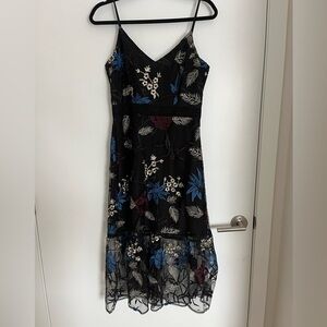BB Dakota black embroidered cocktail dress with sheer hem. Worn once.
